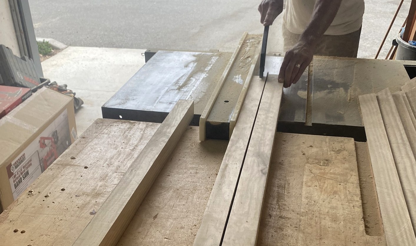Raw Accoya board being cut on the saw